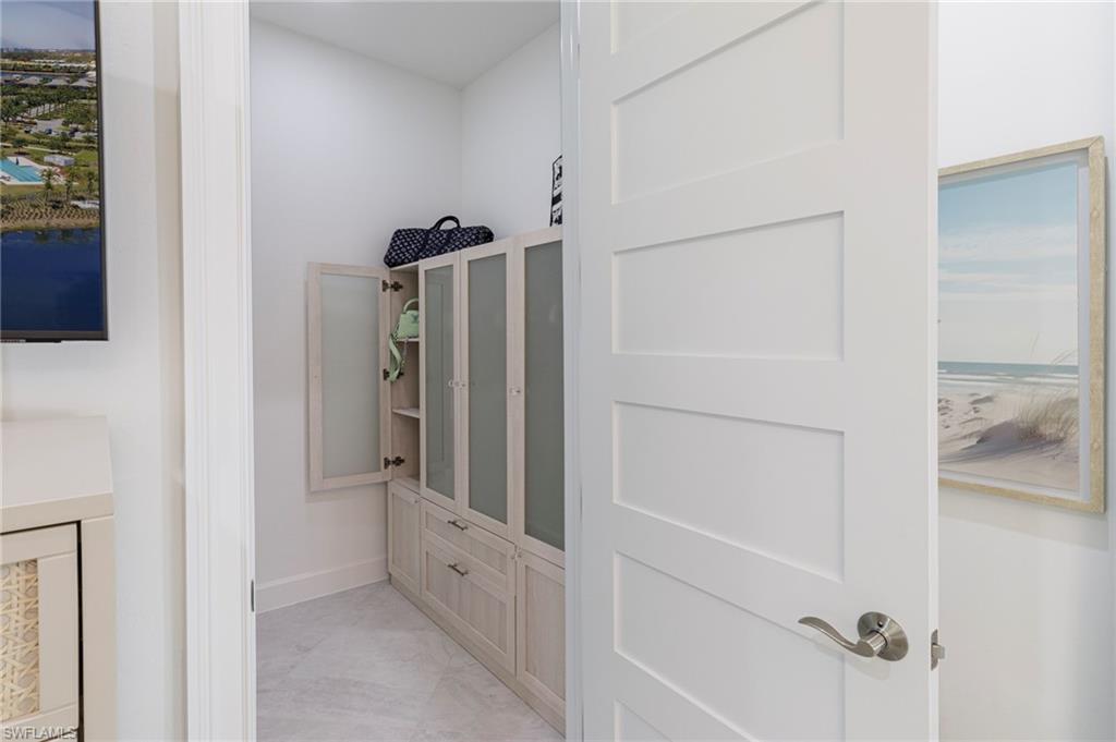 8963 Gustavia Court Naples, FL 34113 - Photo 20 of 47 a view of a walk in closet