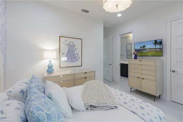 a bathroom with a sink shower and a mirror