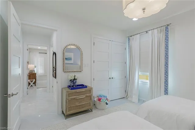 a bathroom with a toilet a sink and a mirror