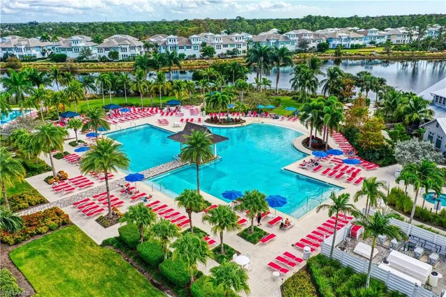 swimming pool with outdoor seating and yard