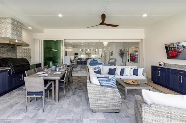 a large kitchen with a table and chairs