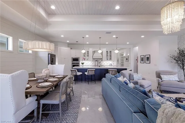 a kitchen with a table and chairs in it
