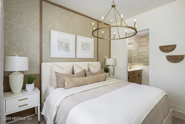 a bathroom with a granite countertop double vanity sink and a mirror