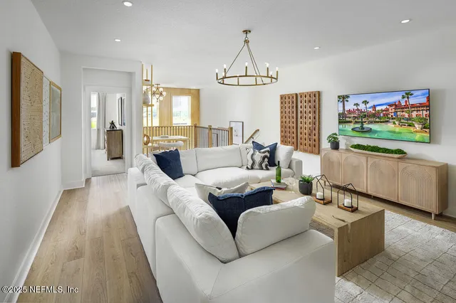 a dining room with furniture a rug and wooden floor