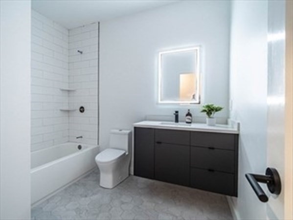 243 Condor Street, Unit 3 Boston, MA 02128 - Photo 15 of 16 a bathroom with a sink toilet and shower