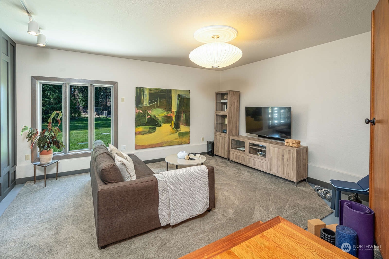 11907 103rd Avenue Southwest Vashon, WA 98070 - Photo 14 of 40 a living room with furniture and a flat screen tv