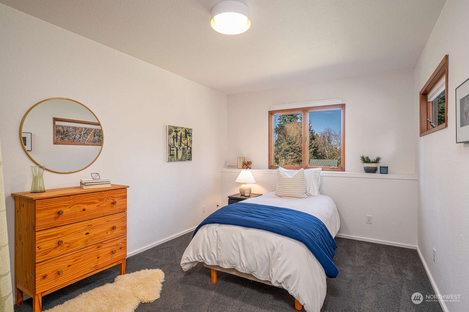 11907 103rd Avenue Southwest Vashon, WA 98070 - Photo 24 of 40 a bedroom with a bed and a dresser