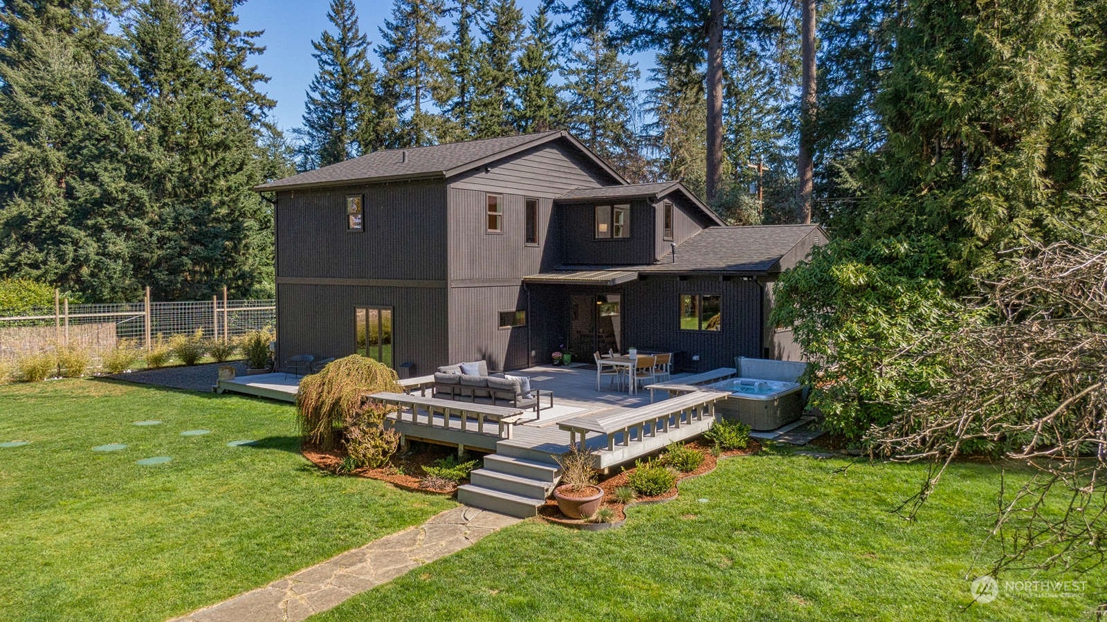 11907 103rd Avenue Southwest Vashon, WA 98070 - Photo 26 of 40 a view of house with backyard and outdoor seating