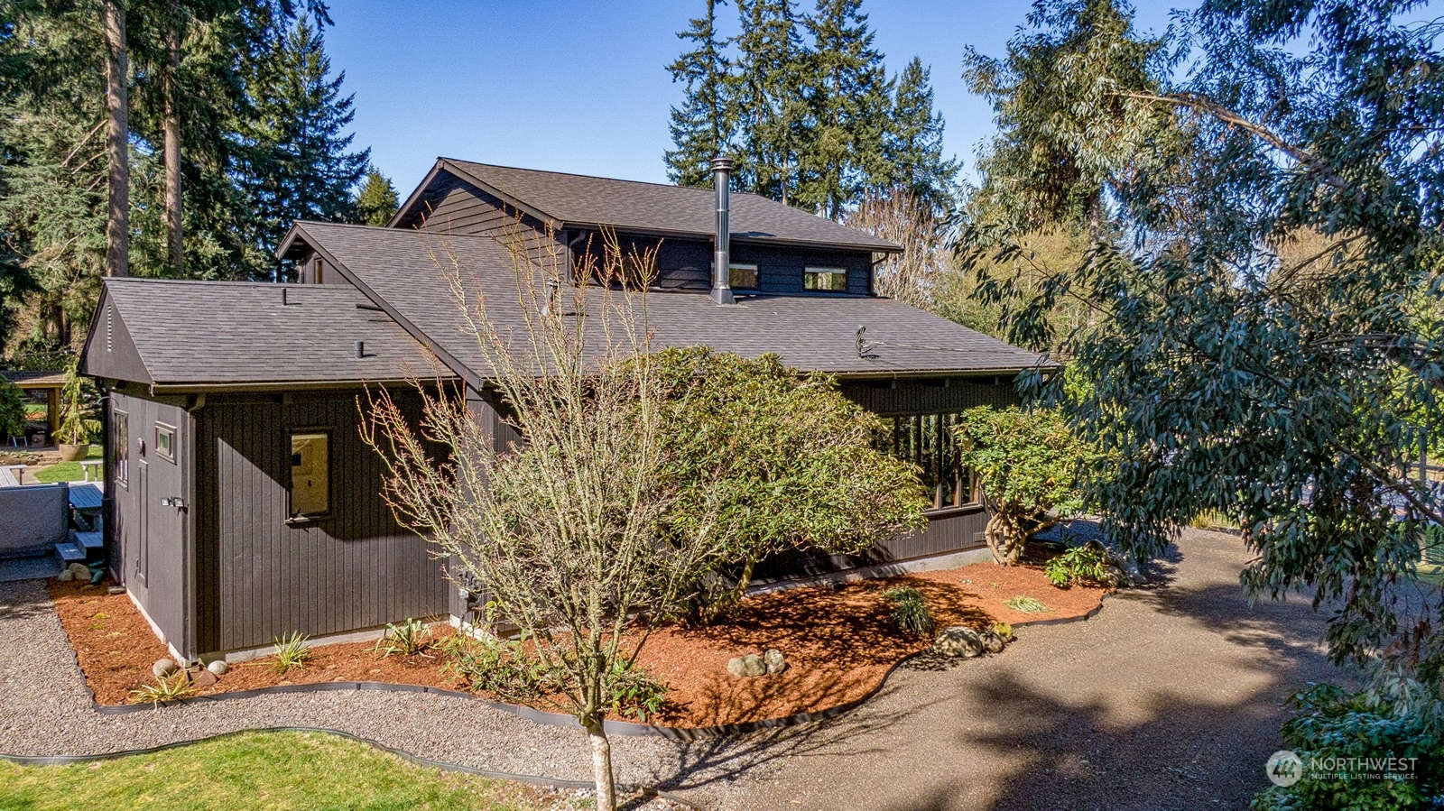 11907 103rd Avenue Southwest Vashon, WA 98070 - Photo 37 of 40 a view of a house with roof and sitting area