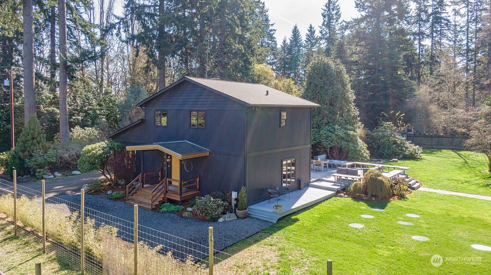 11907 103rd Avenue Southwest Vashon, WA 98070 - Photo 39 of 40 a front view of a house with swimming pool garden and patio