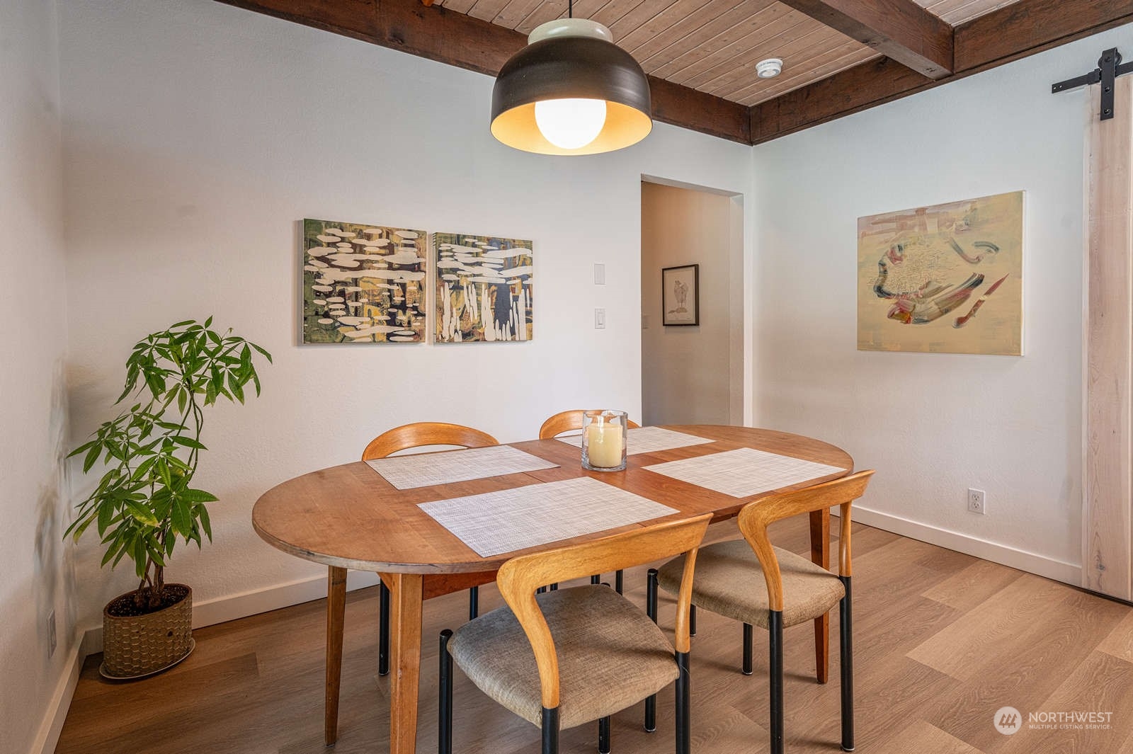11907 103rd Avenue Southwest Vashon, WA 98070 - Photo 7 of 40 a view of a dining room with furniture and wooden floor