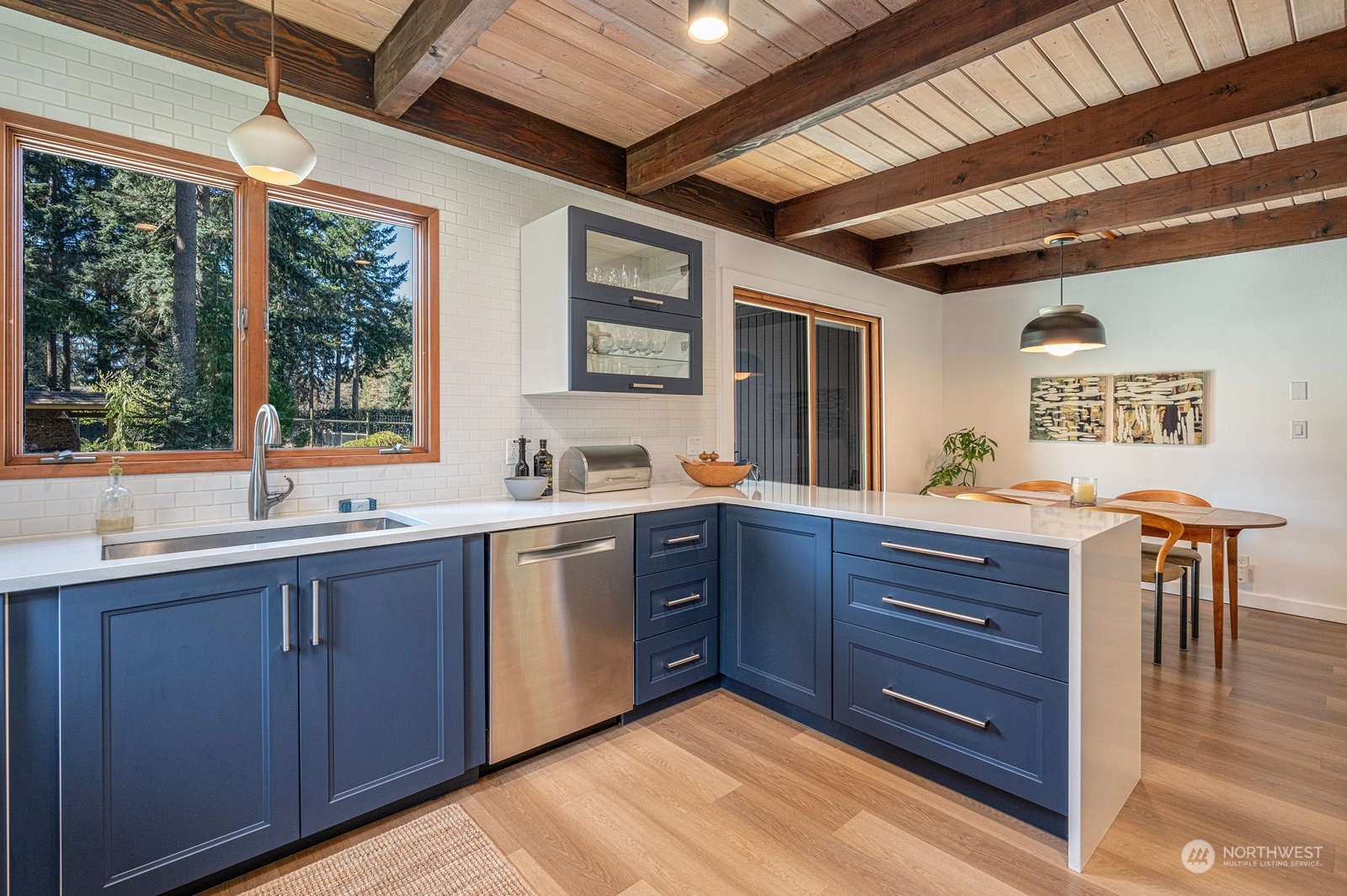 11907 103rd Avenue Southwest Vashon, WA 98070 - Photo 9 of 40 a kitchen with wooden cabinets and sink