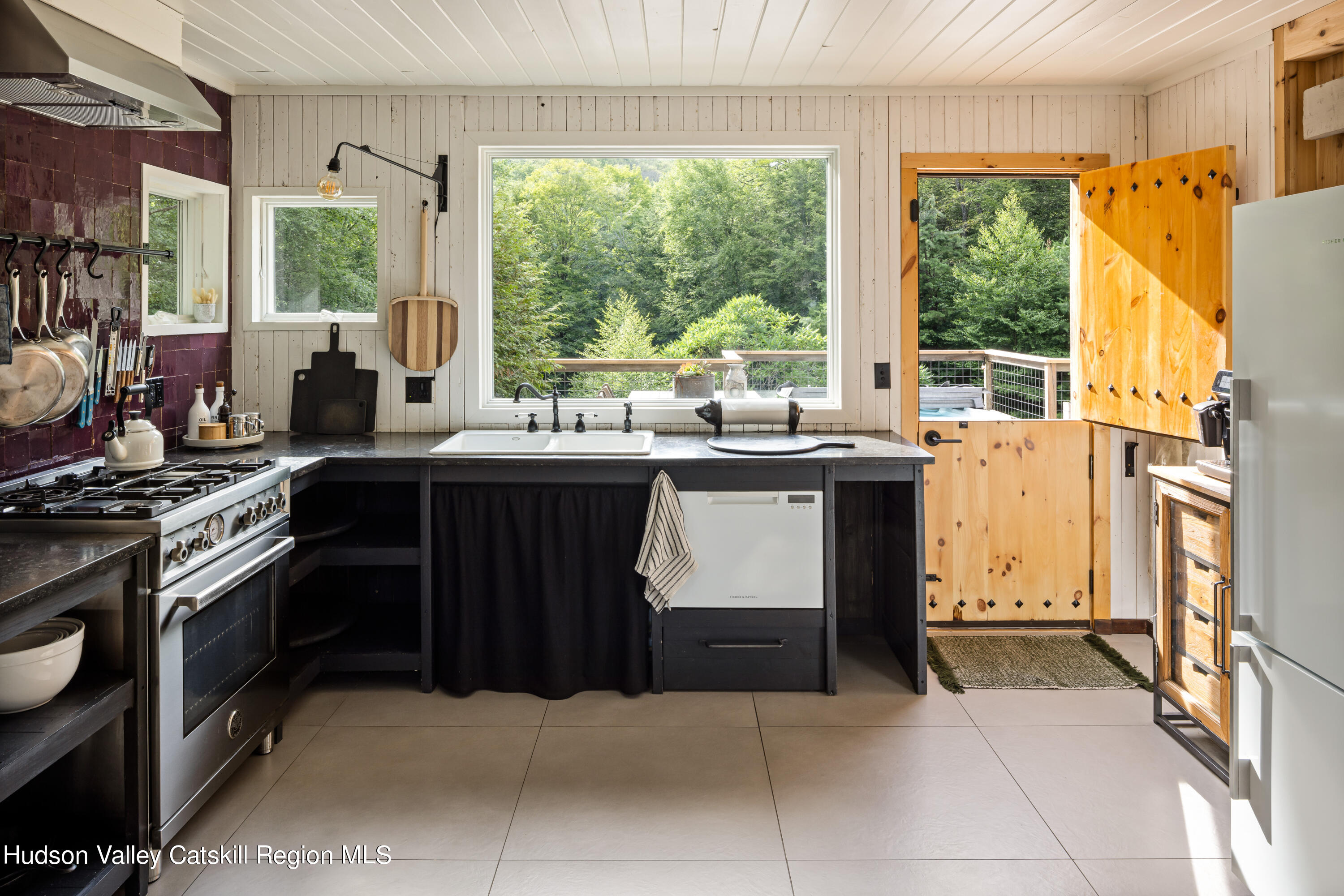 193 Cantine Road Kingston, NY 12401 - Photo 16 of 36 a kitchen with a sink stove and cabinets