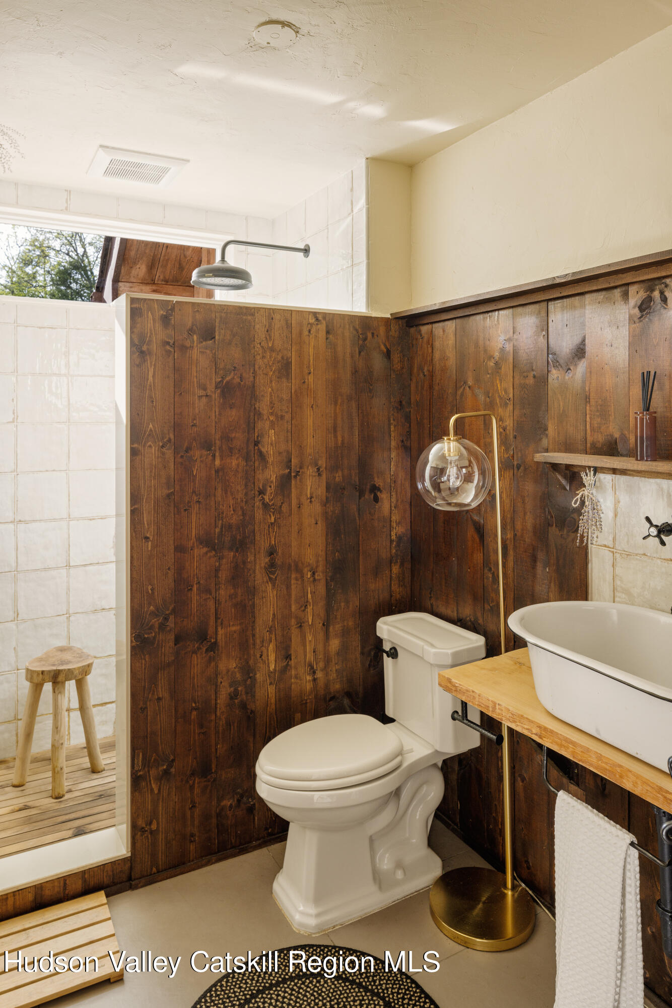 193 Cantine Road Kingston, NY 12401 - Photo 17 of 36 a white toilet sitting next to a bathroom sink
