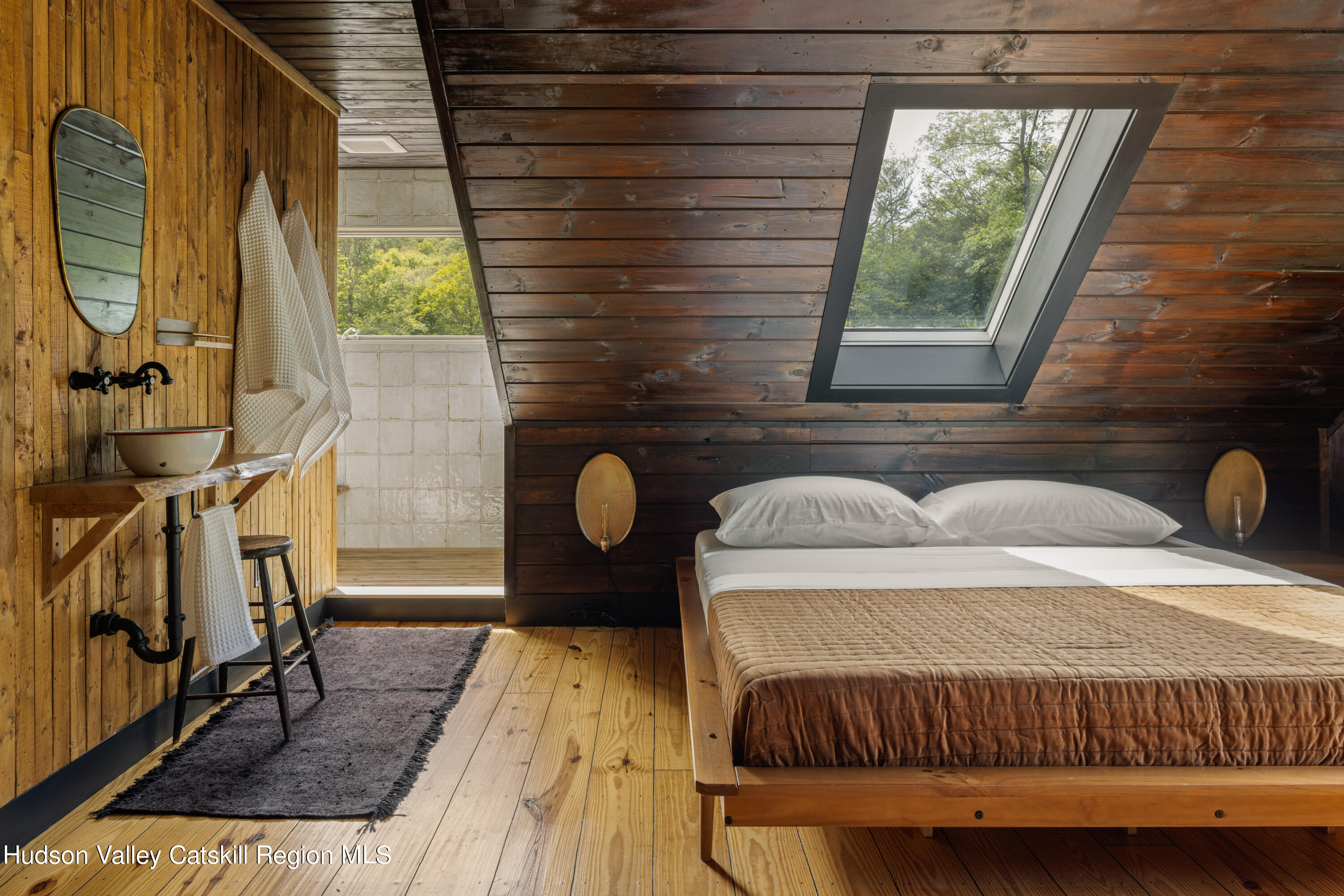 193 Cantine Road Kingston, NY 12401 - Photo 19 of 36 a bedroom with a bed and wooden floor