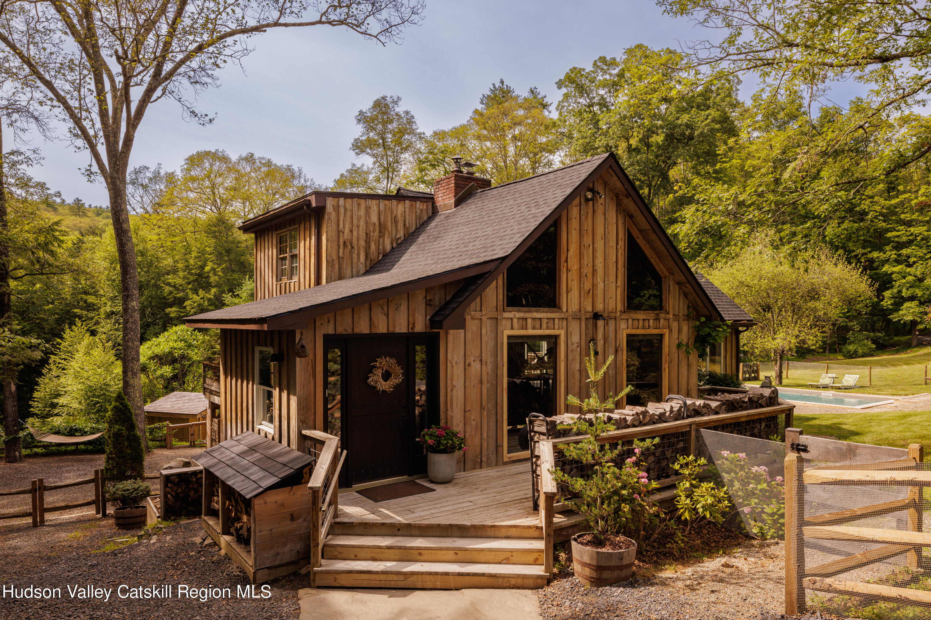 193 Cantine Road Kingston, NY 12401 - Photo 2 of 36 a view of a house with wooden walls and furniture
