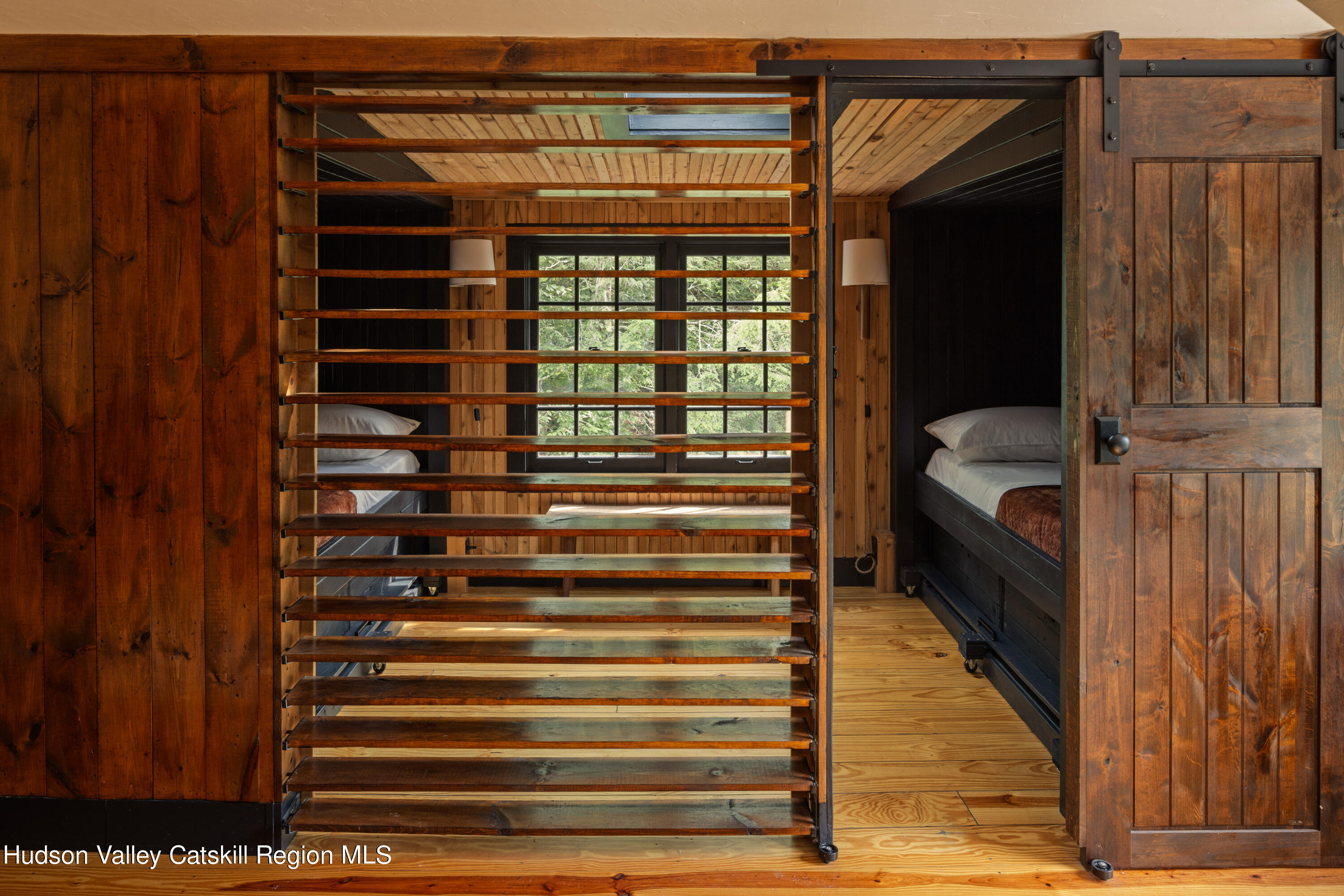 193 Cantine Road Kingston, NY 12401 - Photo 23 of 36 a bedroom with a bed and wooden floor