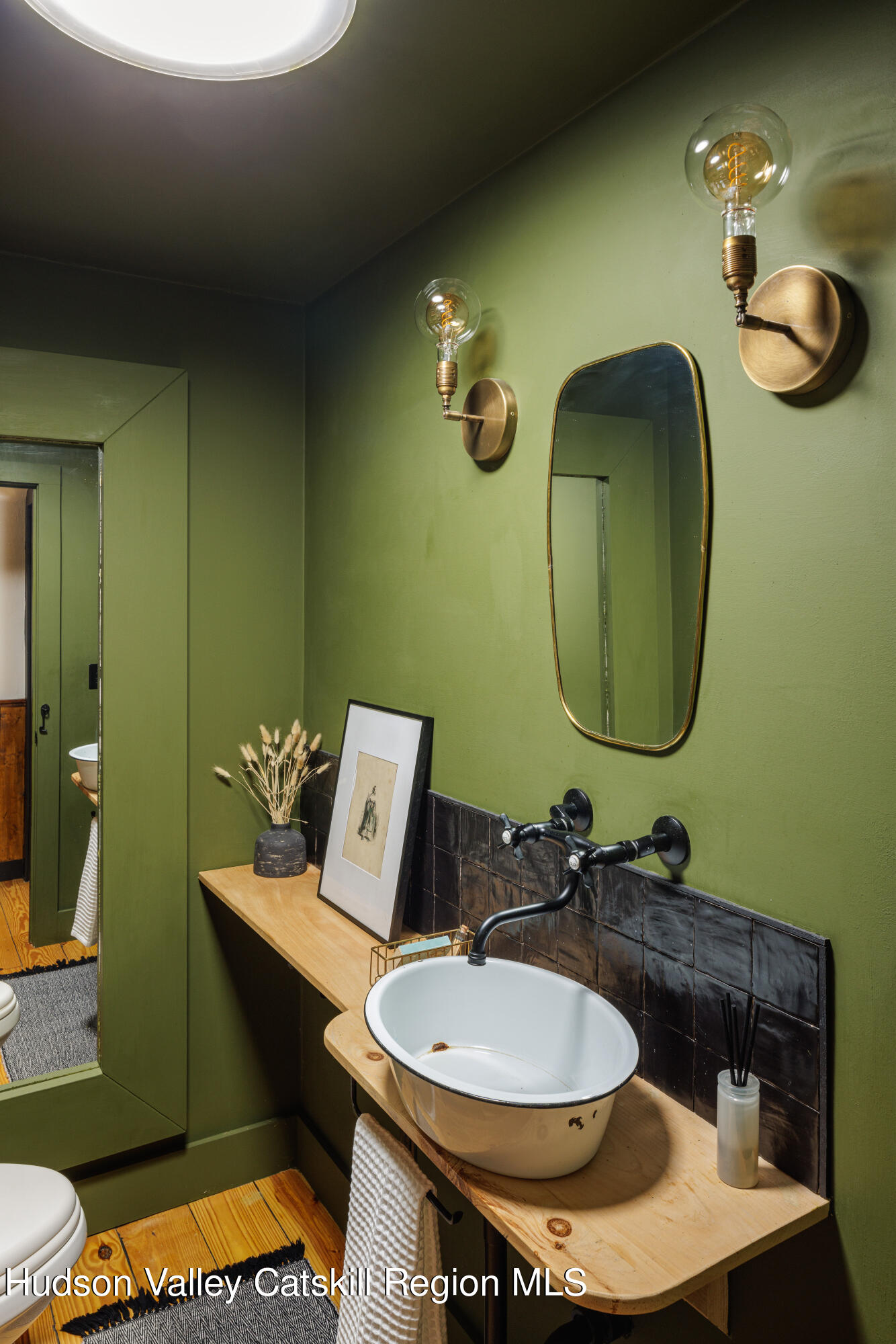 193 Cantine Road Kingston, NY 12401 - Photo 25 of 36 a bathroom with a sink and a mirror