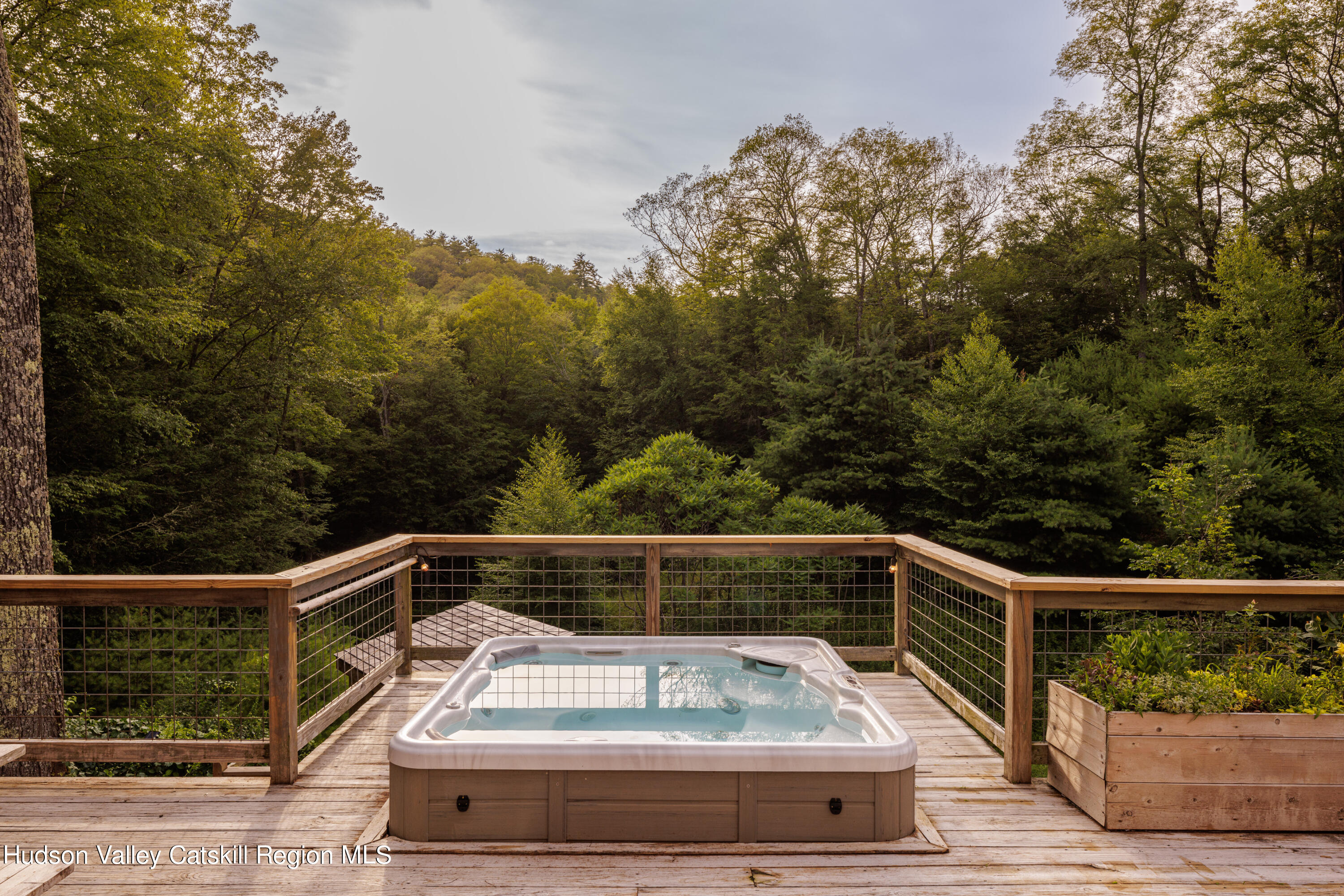 193 Cantine Road Kingston, NY 12401 - Photo 29 of 36 a view of deck with seating and trees