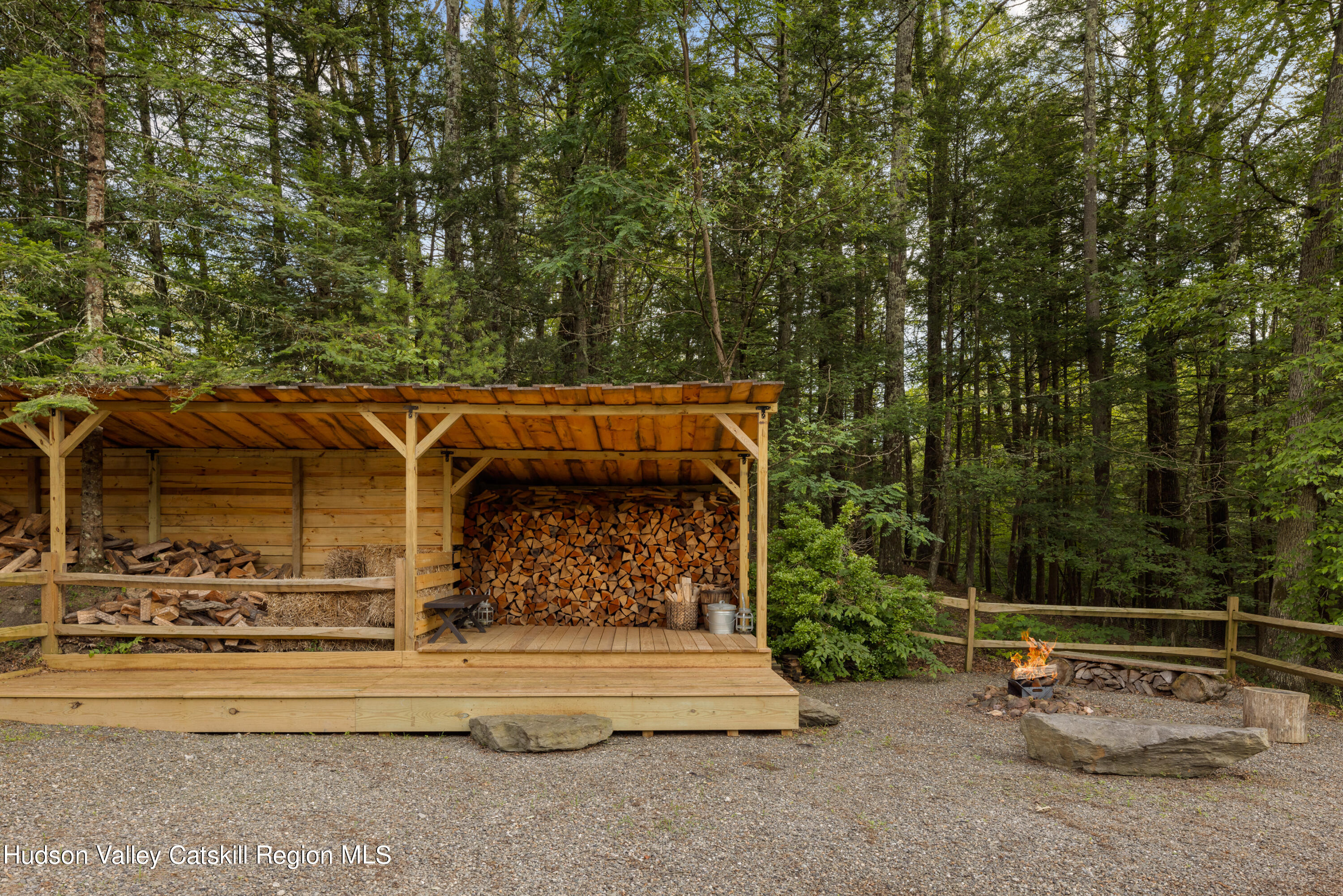 193 Cantine Road Kingston, NY 12401 - Photo 31 of 36 a view of backyard with lawn chairs and large tree