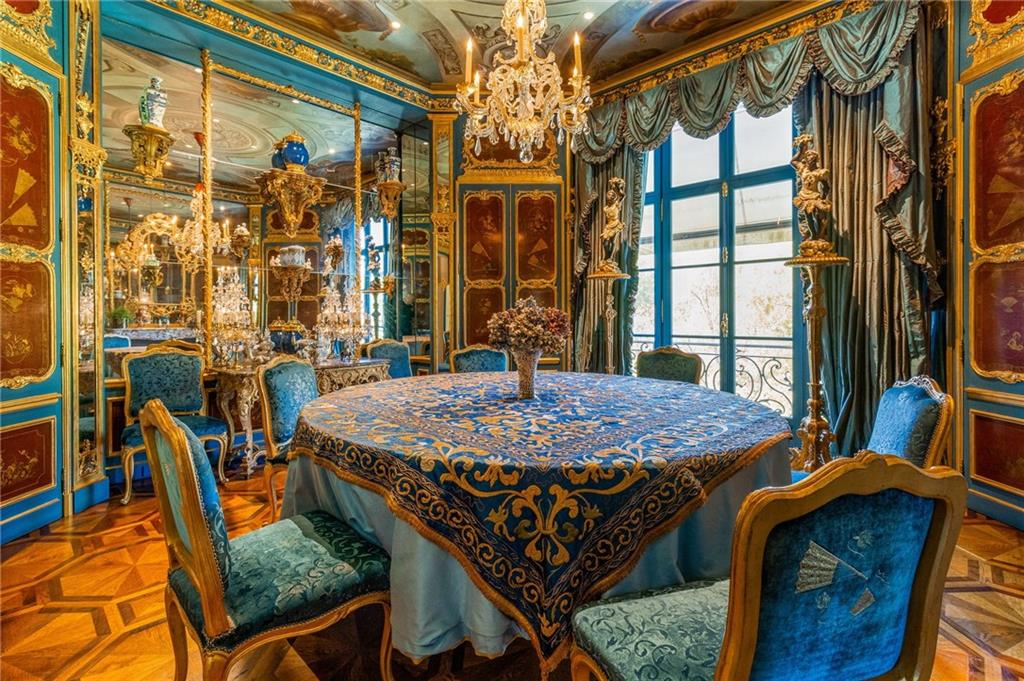 2288 Peachtree Road Northwest, Unit 6 Atlanta, GA 30309 - Photo 23 of 87 a dining room with a table chairs and a chandelier