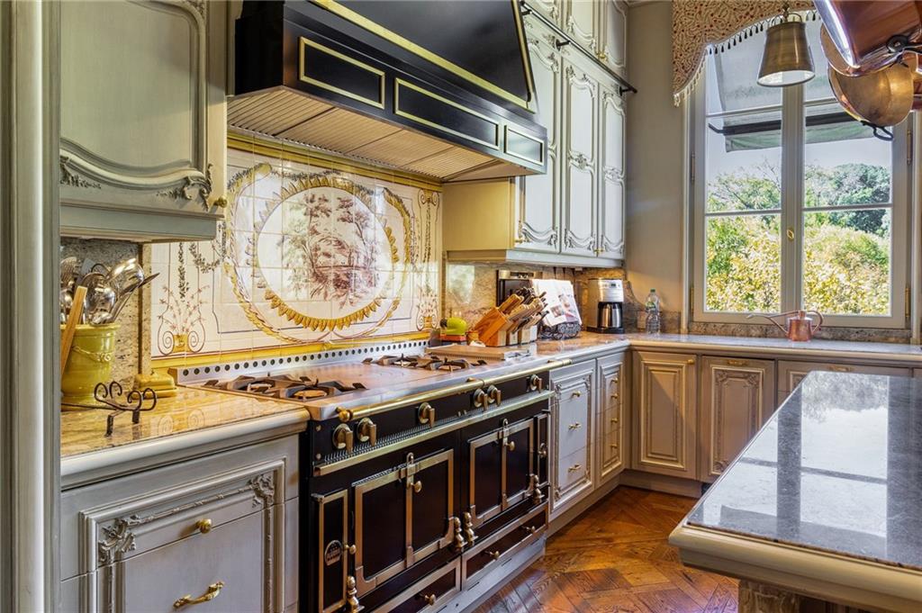 2288 Peachtree Road Northwest, Unit 6 Atlanta, GA 30309 - Photo 28 of 87 a kitchen with a stove and a sink