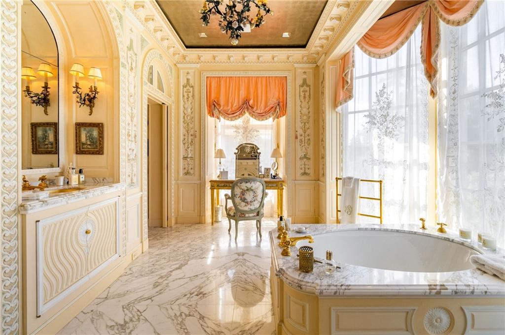 2288 Peachtree Road Northwest, Unit 6 Atlanta, GA 30309 - Photo 45 of 87 a spacious bathroom with a granite countertop tub and a large window