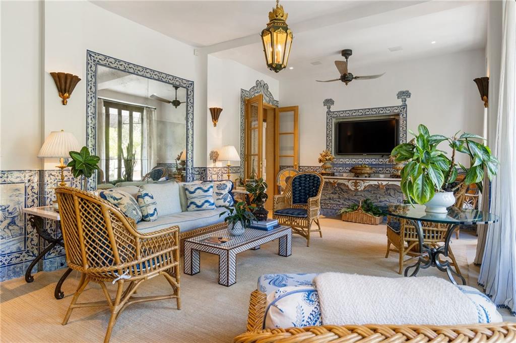 2288 Peachtree Road Northwest, Unit 6 Atlanta, GA 30309 - Photo 6 of 87 a living room with furniture a fireplace and a chandelier