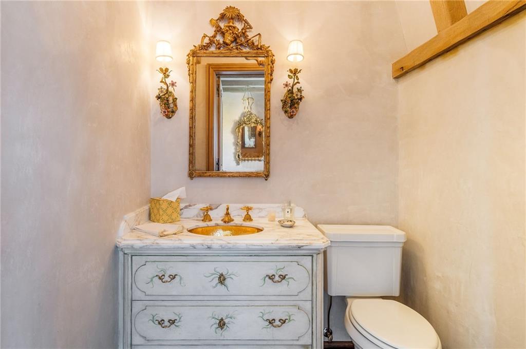 2288 Peachtree Road Northwest, Unit 6 Atlanta, GA 30309 - Photo 63 of 87 a bathroom with a toilet sink and mirror