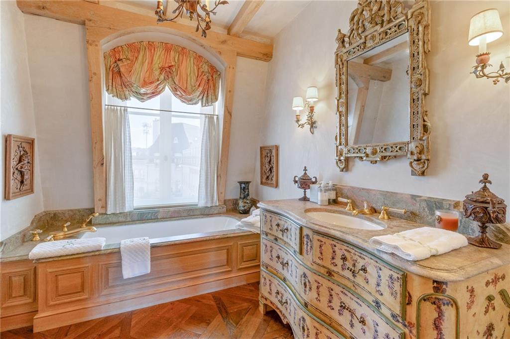 2288 Peachtree Road Northwest, Unit 6 Atlanta, GA 30309 - Photo 67 of 87 a bathroom with a granite countertop double vanity sink and a mirror