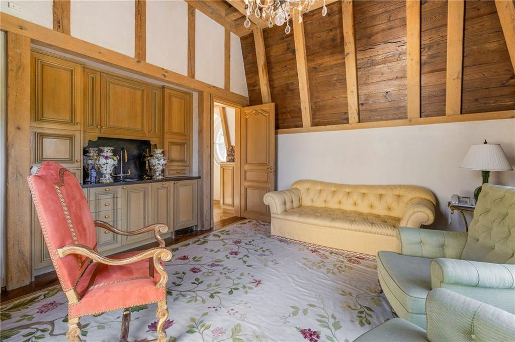 2288 Peachtree Road Northwest, Unit 6 Atlanta, GA 30309 - Photo 72 of 87 a living room with furniture a flat screen tv and a window