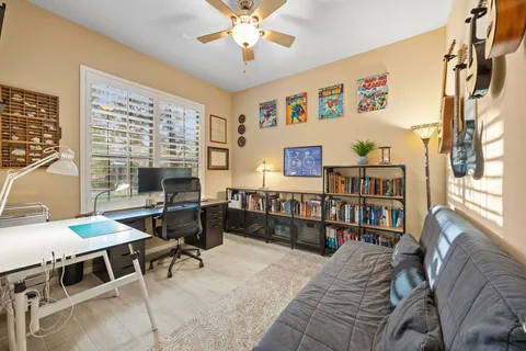 a bedroom with furniture and a window