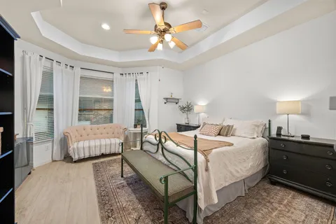 a bedroom with a bed and a couch