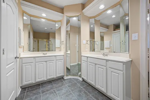 workspace with double vanity sink and a mirror