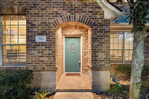 a front view of a house with a glass door