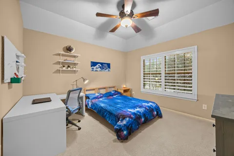 a bed room with a bed and a window