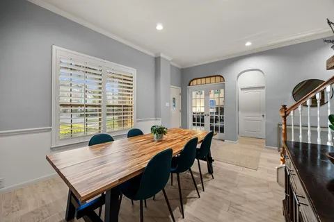 a view of a dining room with furniture and window