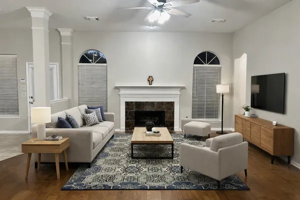 a living room with furniture and a fireplace