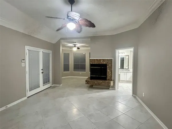 a view of livingroom with furniture fireplace and chandelier fan