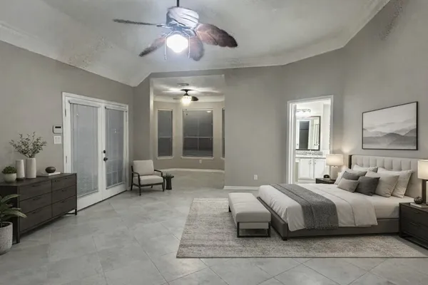 a spacious bedroom with a bed and ceiling fan