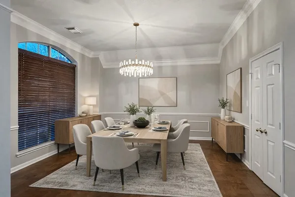 a dining room with furniture and window