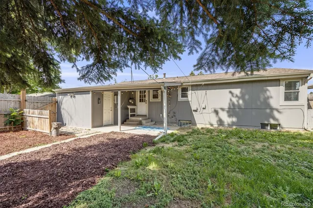 front view of a house with a tree