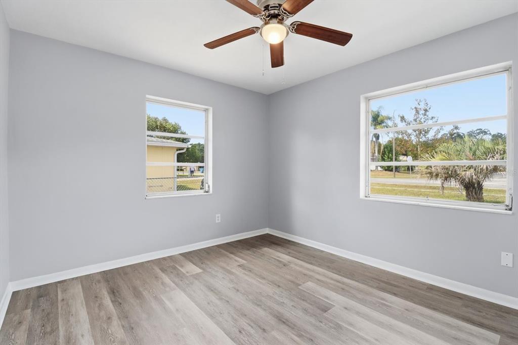 6832 Treehaven Drive Spring Hill, FL 34606 - Photo 11 of 29 a view of an empty room with a window and a painting on the wall