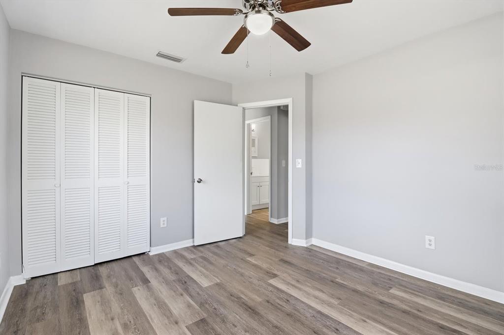 6832 Treehaven Drive Spring Hill, FL 34606 - Photo 12 of 29 a view of empty room with wooden floor