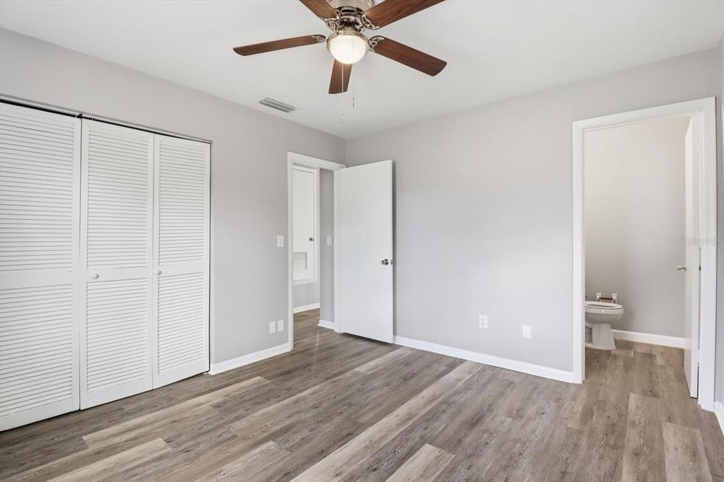6832 Treehaven Drive Spring Hill, FL 34606 - Photo 14 of 29 a view of empty room with wooden floor