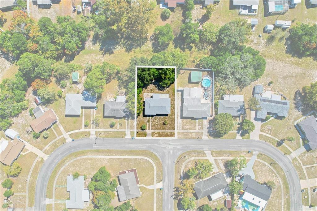 6832 Treehaven Drive Spring Hill, FL 34606 - Photo 2 of 29 an aerial view of a swimming pool with outdoor seating
