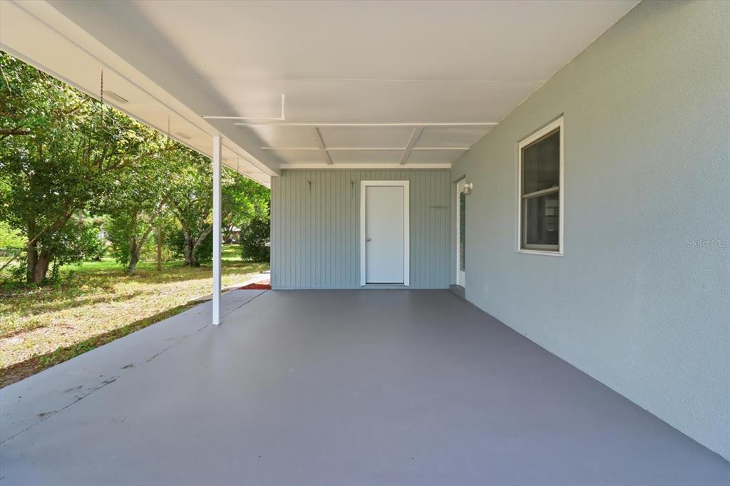 6832 Treehaven Drive Spring Hill, FL 34606 - Photo 22 of 29 a view of a livingroom with an empty space and balcony