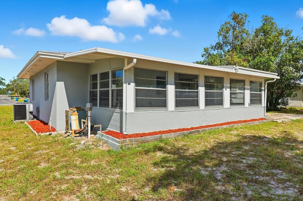6832 Treehaven Drive Spring Hill, FL 34606 - Photo 23 of 29 a view of a house with pool and sitting area