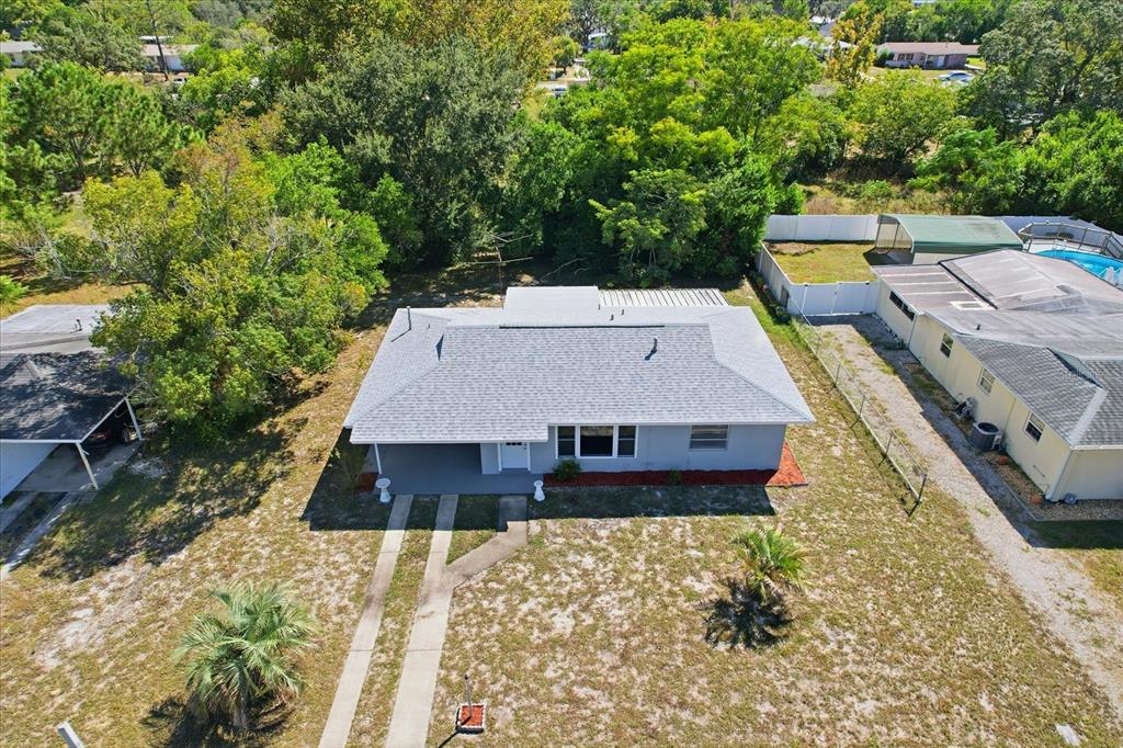 6832 Treehaven Drive Spring Hill, FL 34606 - Photo 26 of 29 a aerial view of a house with a yard