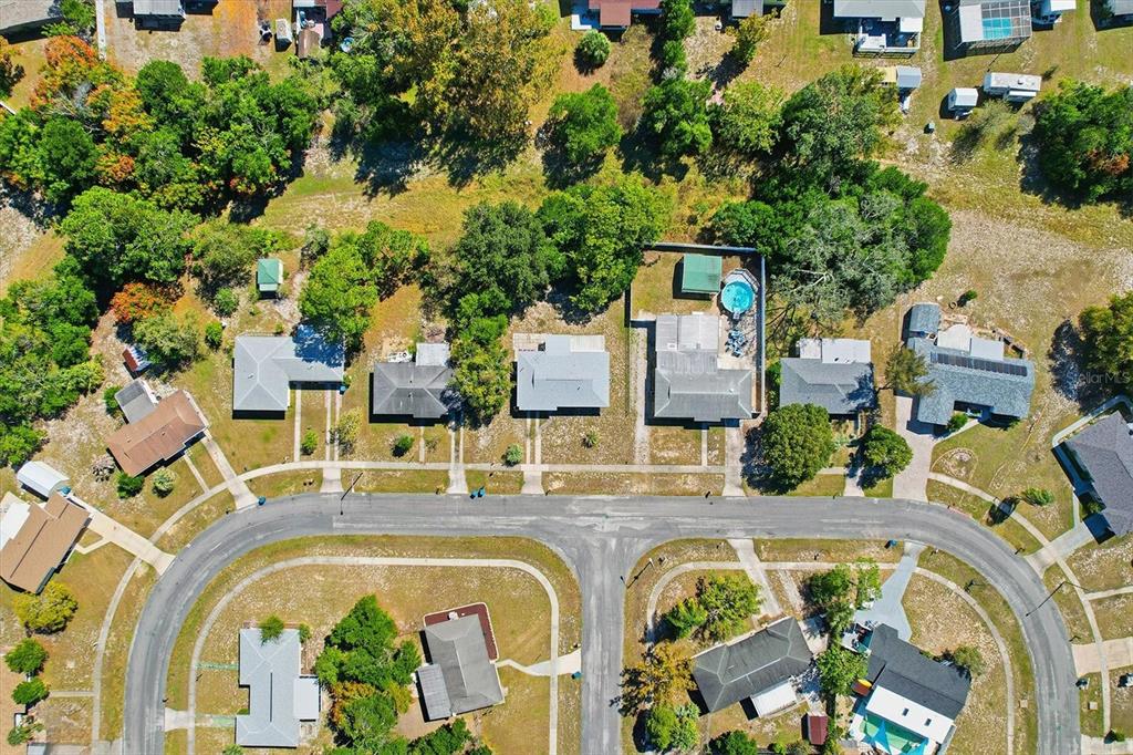 6832 Treehaven Drive Spring Hill, FL 34606 - Photo 27 of 29 an aerial view of a house with a swimming pool patio and outdoor seating